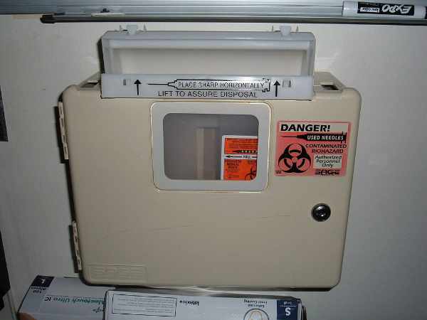 Wall-mounted sharps container