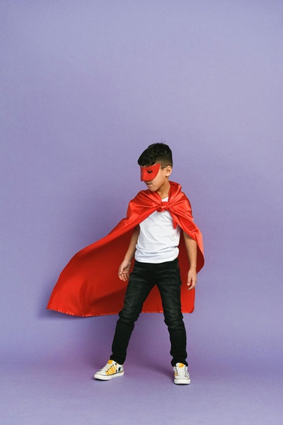 Young boy dressed as a superhero