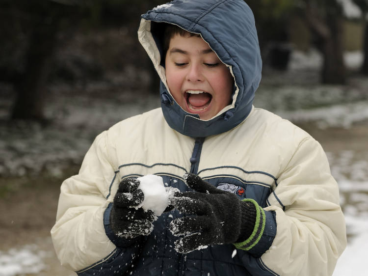 Teen boy getting ready to throw a snowball
