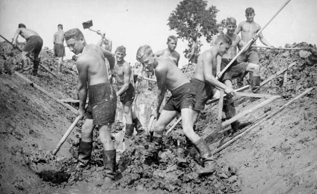 Men digging a ditch