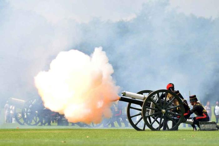 Soldiers firing cannon