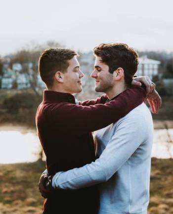Two young men embracing