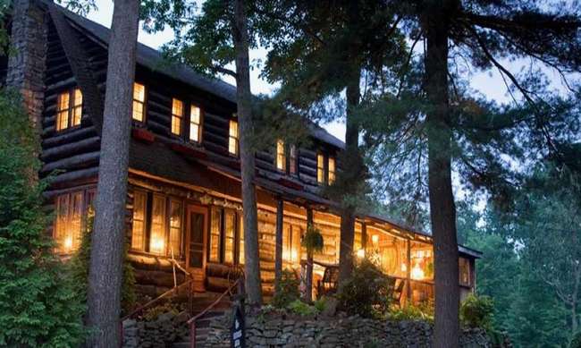 Log cabin set amoung trees