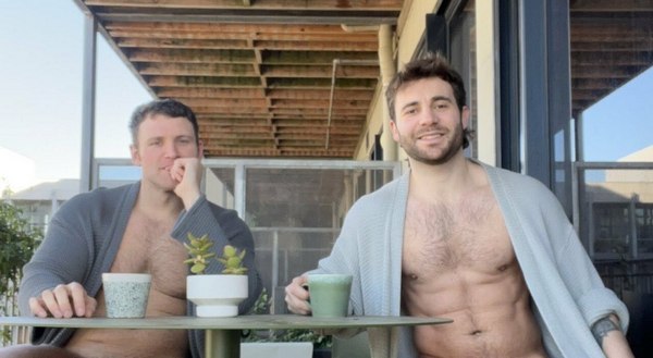 Two young men sitting at a table
