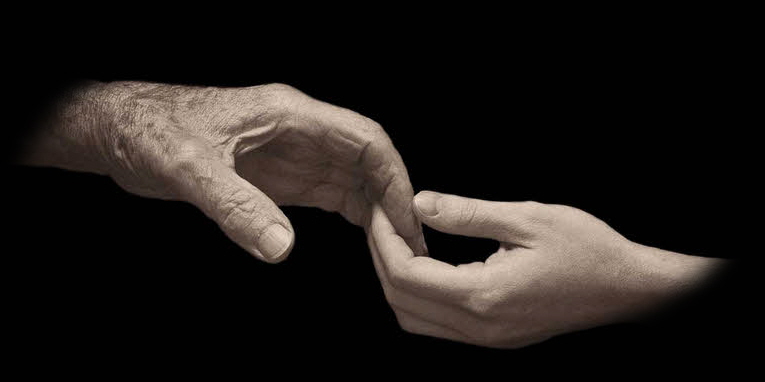 Two hands reaching for each other