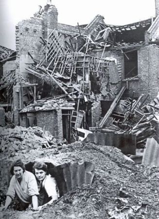 Two people emerging from a shelter