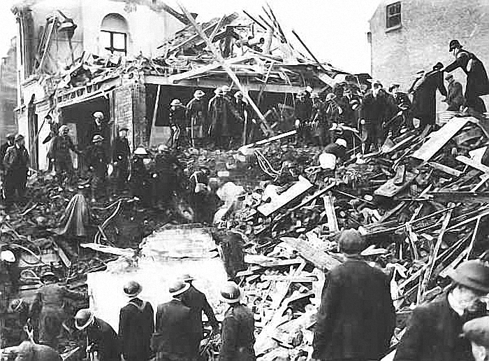 Rescue workers sifting through building wreckage