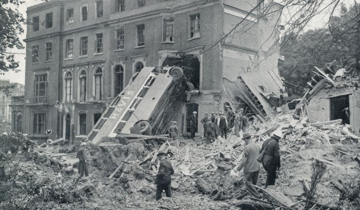 Wrecked buildings and double-decker bus