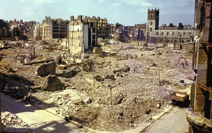 One damaged building standing in a razed block of the city