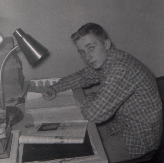 Young Rick sitting at his desk
