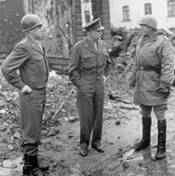 Molitary personel standing among ruins
